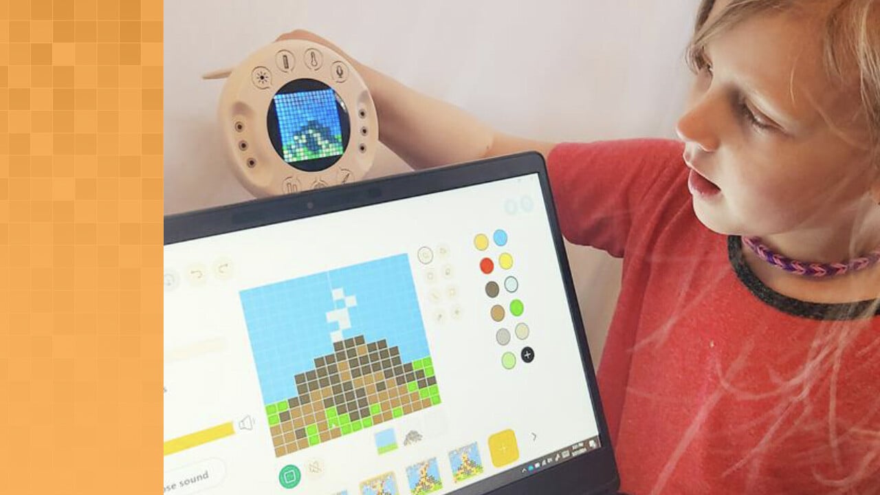 Young student holding an Xploris above a laptop screen. Both the Xploris grid and laptop screen show an image of a pixelated mountain. The laptop screen also shows how the animation will be added to the mountain image.